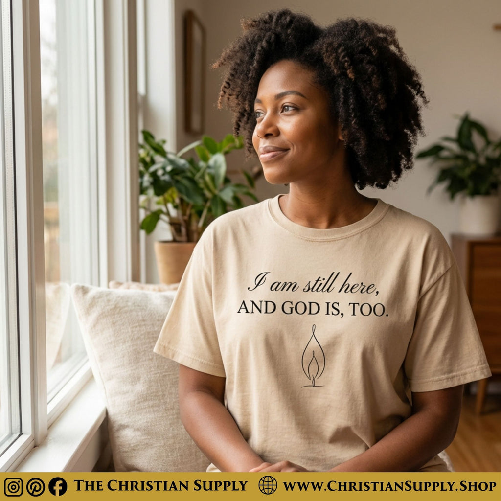 I Am Still Here, And God Is Too – Encouragement Christian T‑Shirt