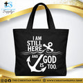 “I Am Still Here, and God Is, Too Anchor” Inspirational Christian Tote Bag – Durable 12oz Cotton Canvas Reusable Shoulder Bag for Daily Use